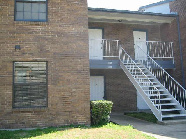 a view of front door of house with stairs