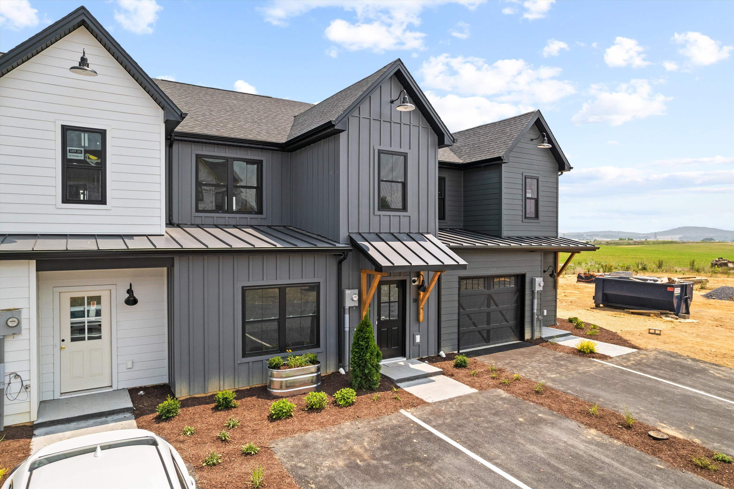 a front view of a house with parking area