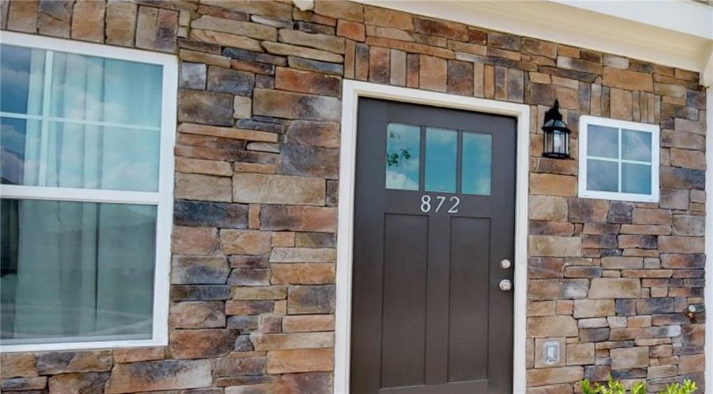 a front view of a house with a glass door