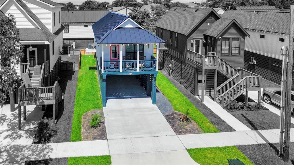 a front view of a house with a yard table and chairs