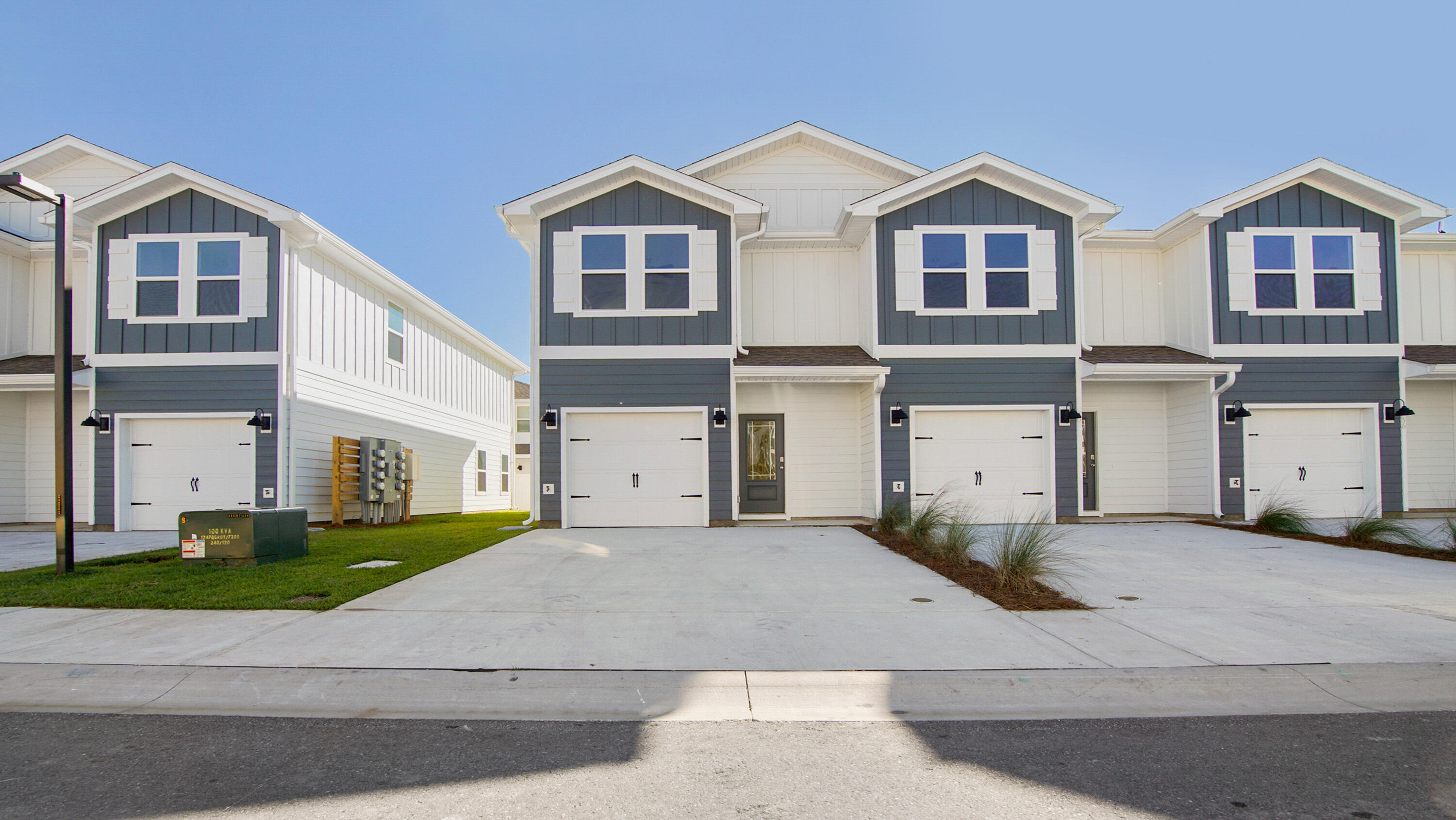 a view of a big house with a street