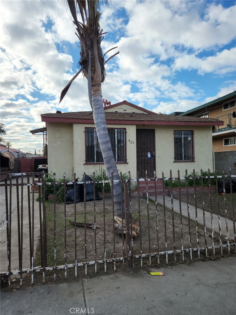 a front view of a house with glass windows