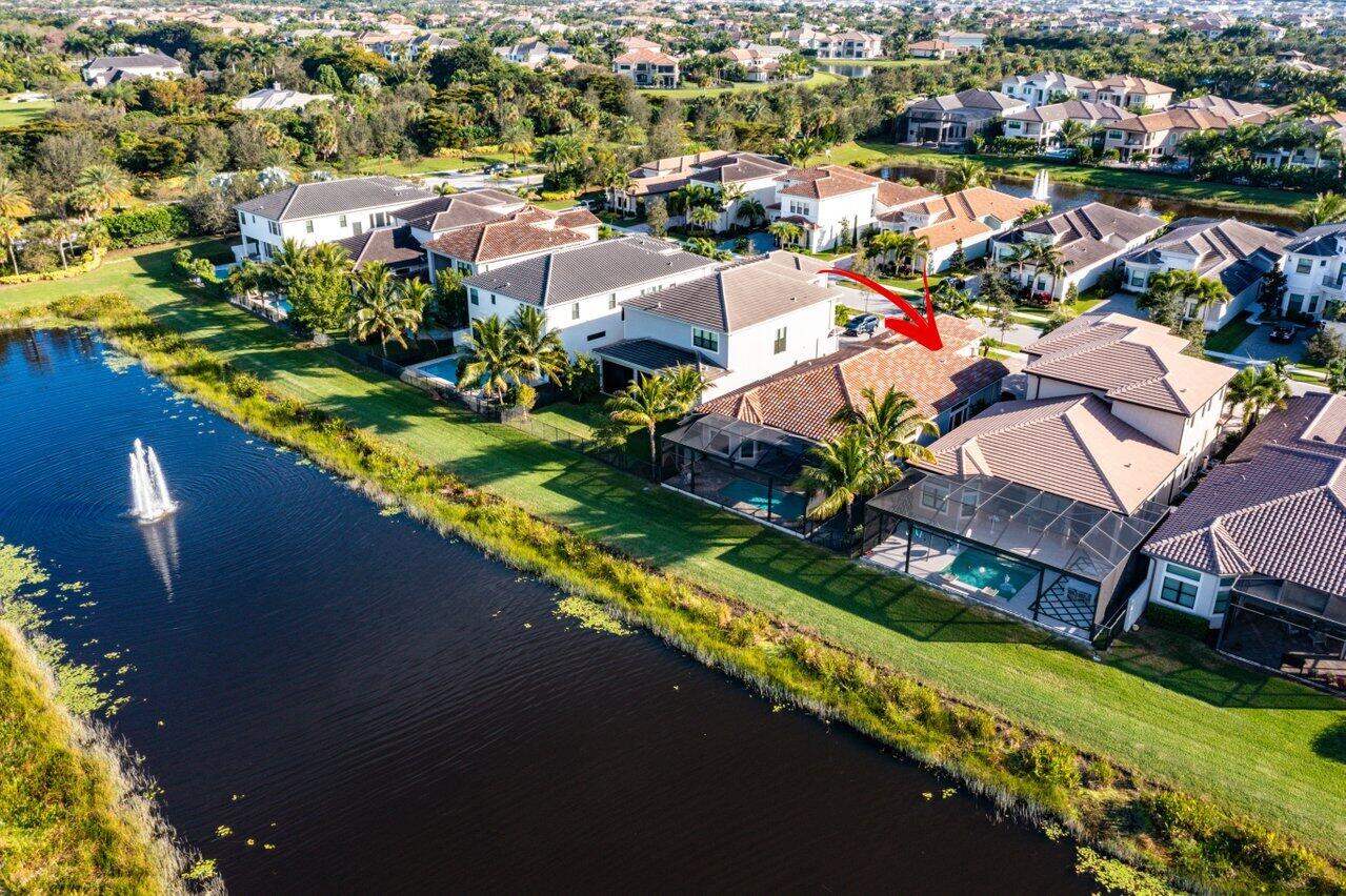 an aerial view of a house with a lake view