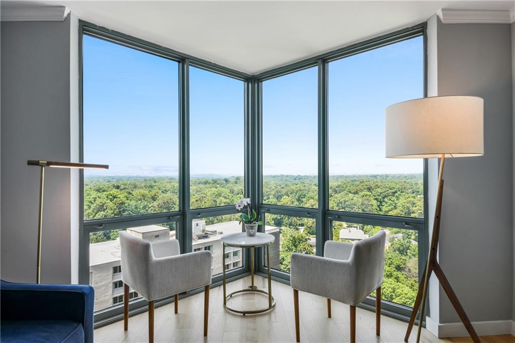 a dining room with furniture and a window