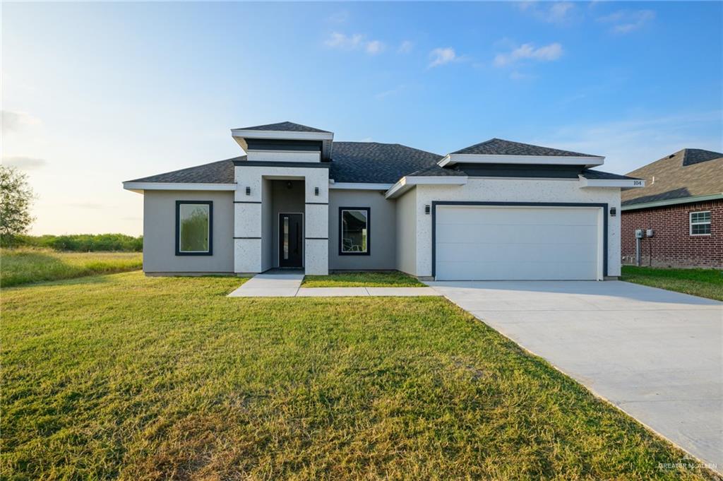 a front view of a house with yard