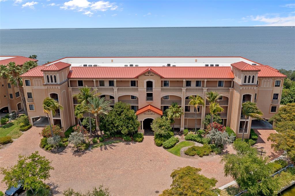 an aerial view of a house with yard and patio