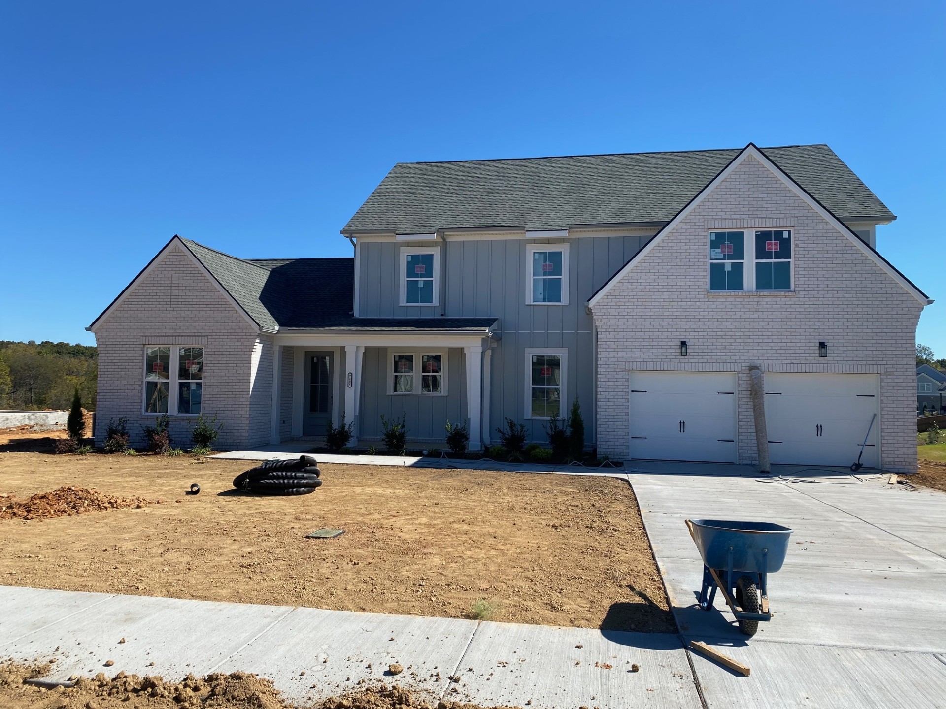 a front view of a house with yard