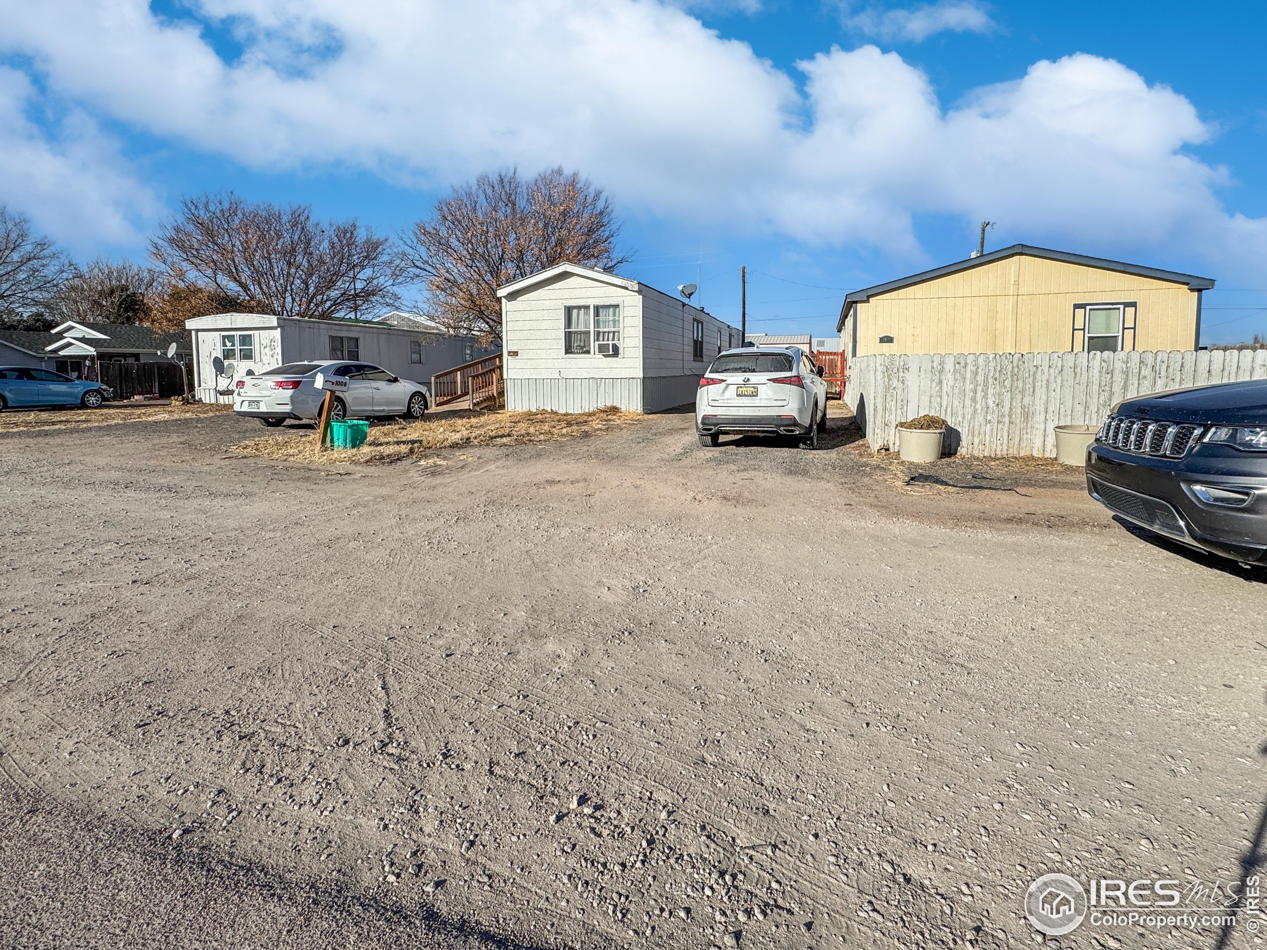 a view of a cars park in front of house