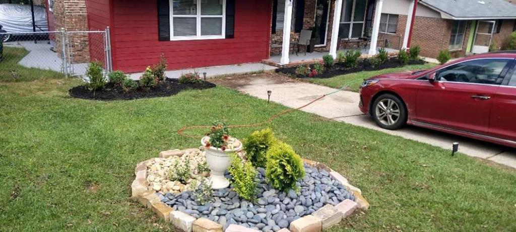 a front view of a house with garden