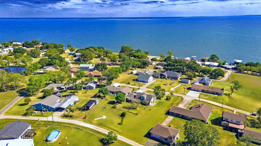 an aerial view of a house with a swimming pool