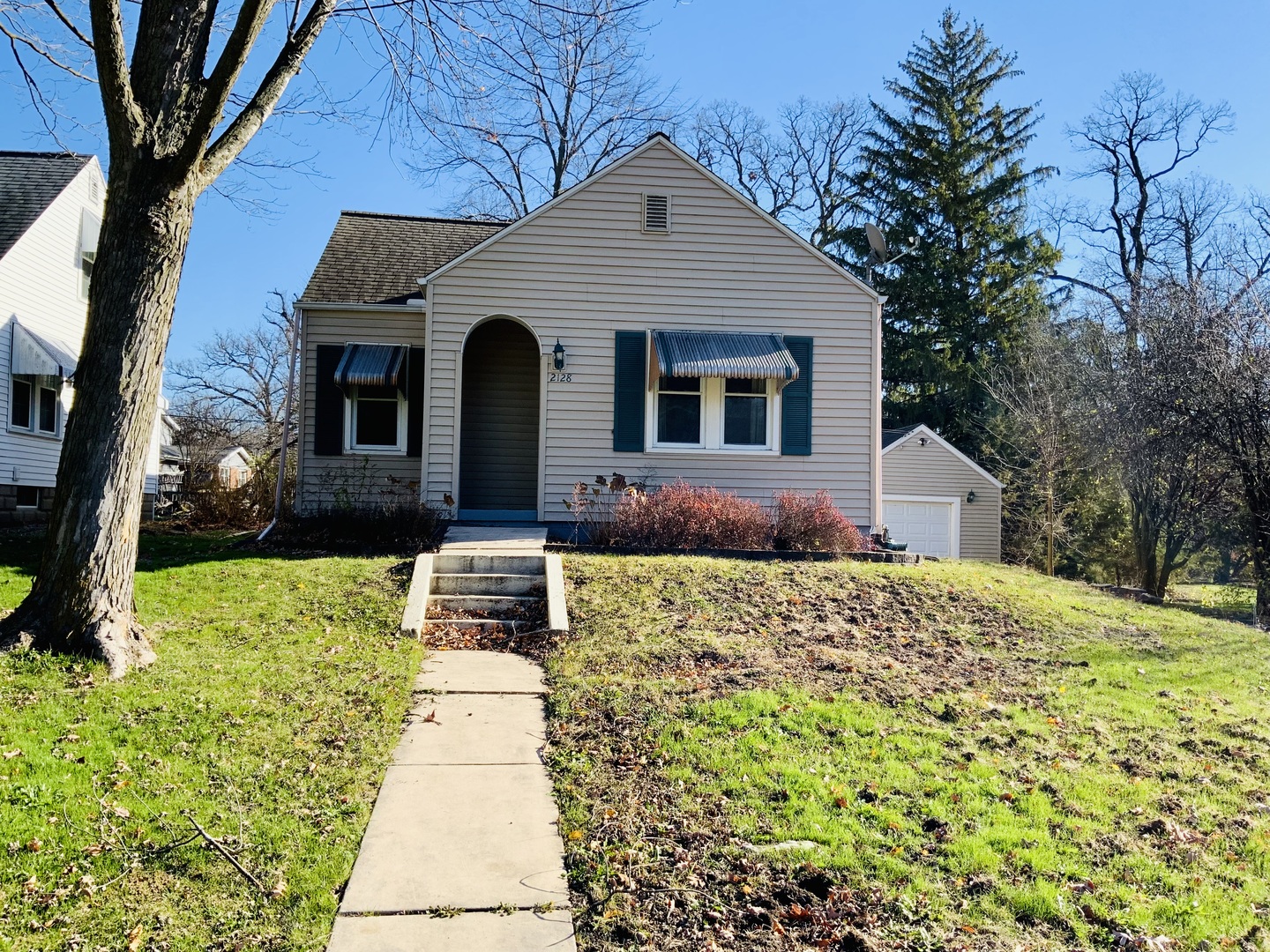 a front view of a house with a yard