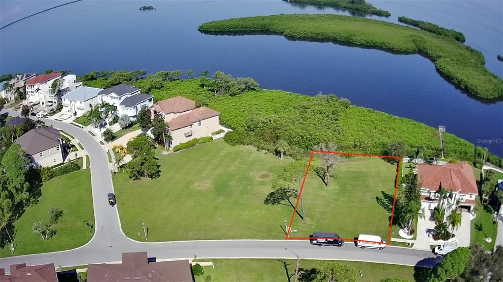 an aerial view of a residential houses with outdoor space and street view