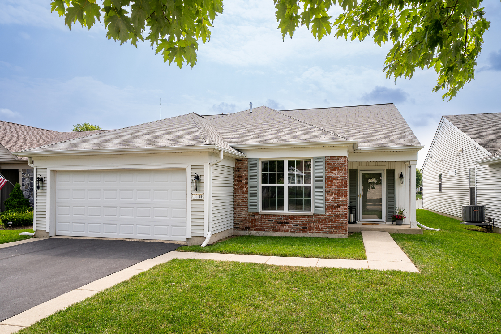 front view of a house with a yard