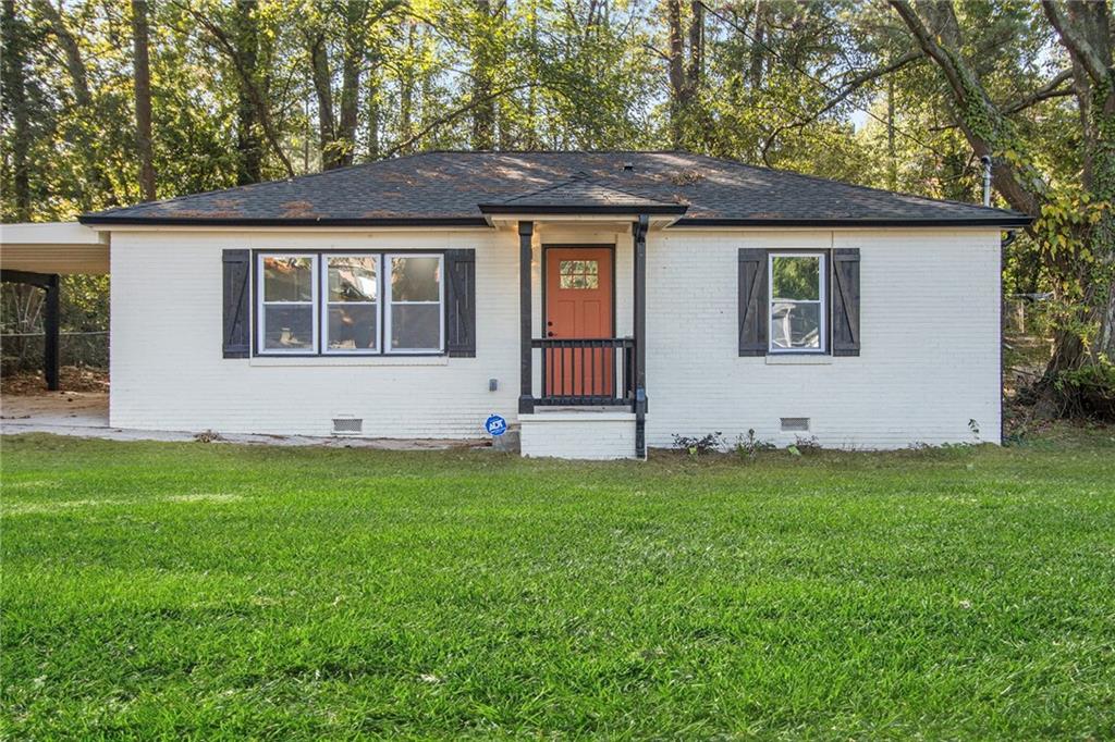 front view of house with a yard