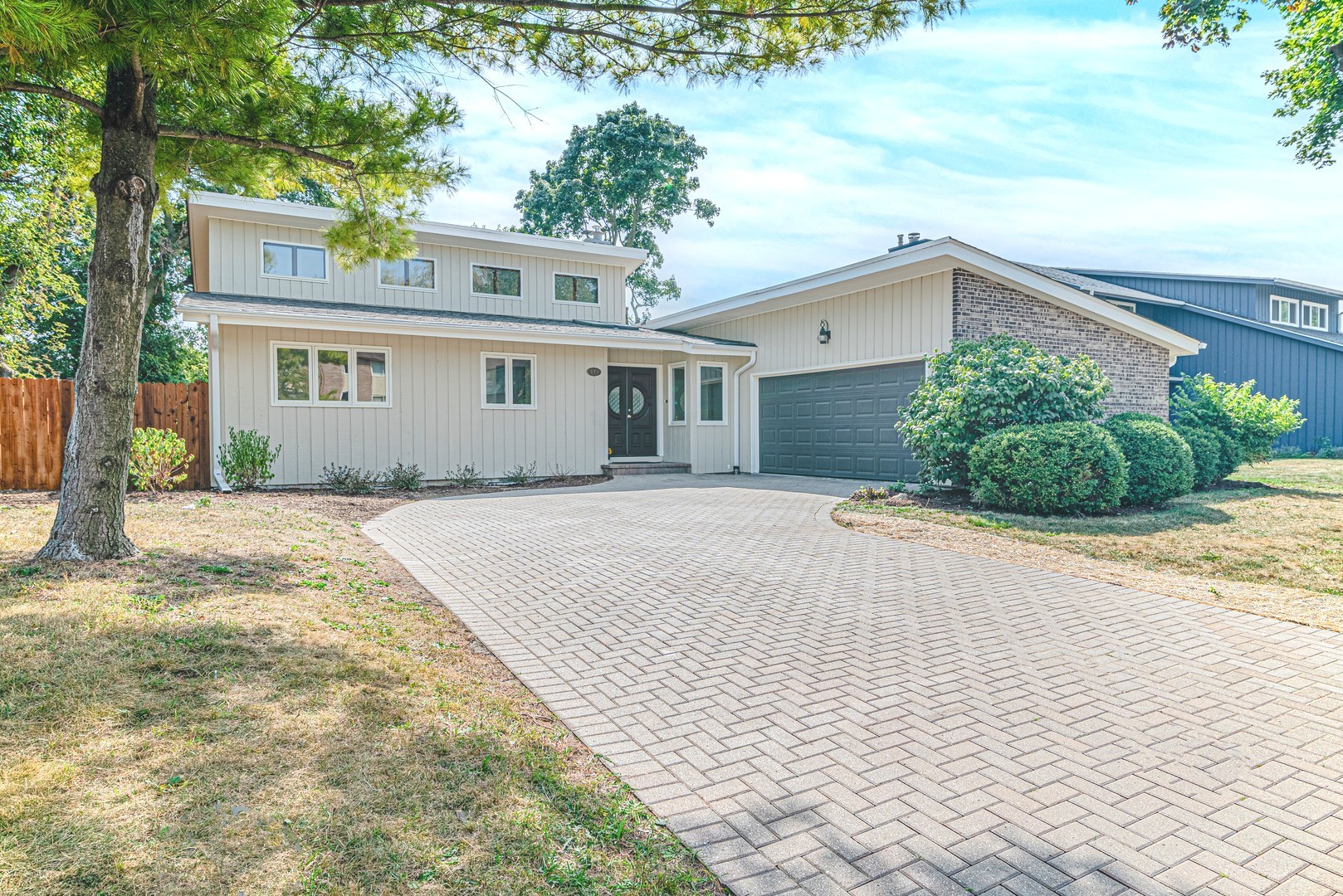 front view of a house with a yard