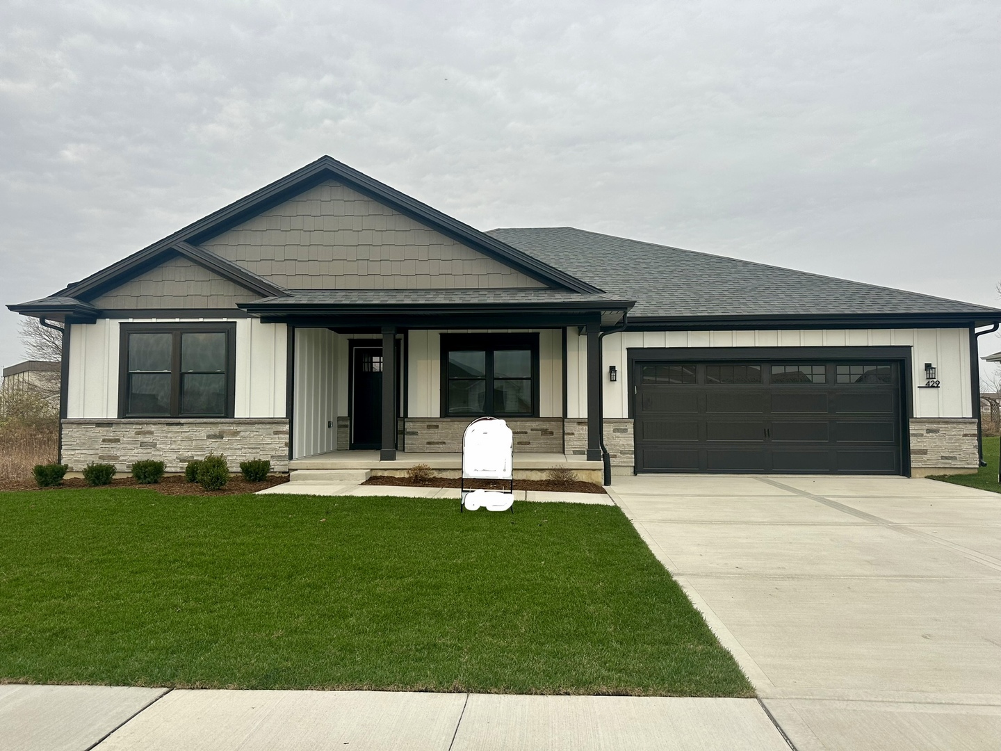 a house with garden in front of it