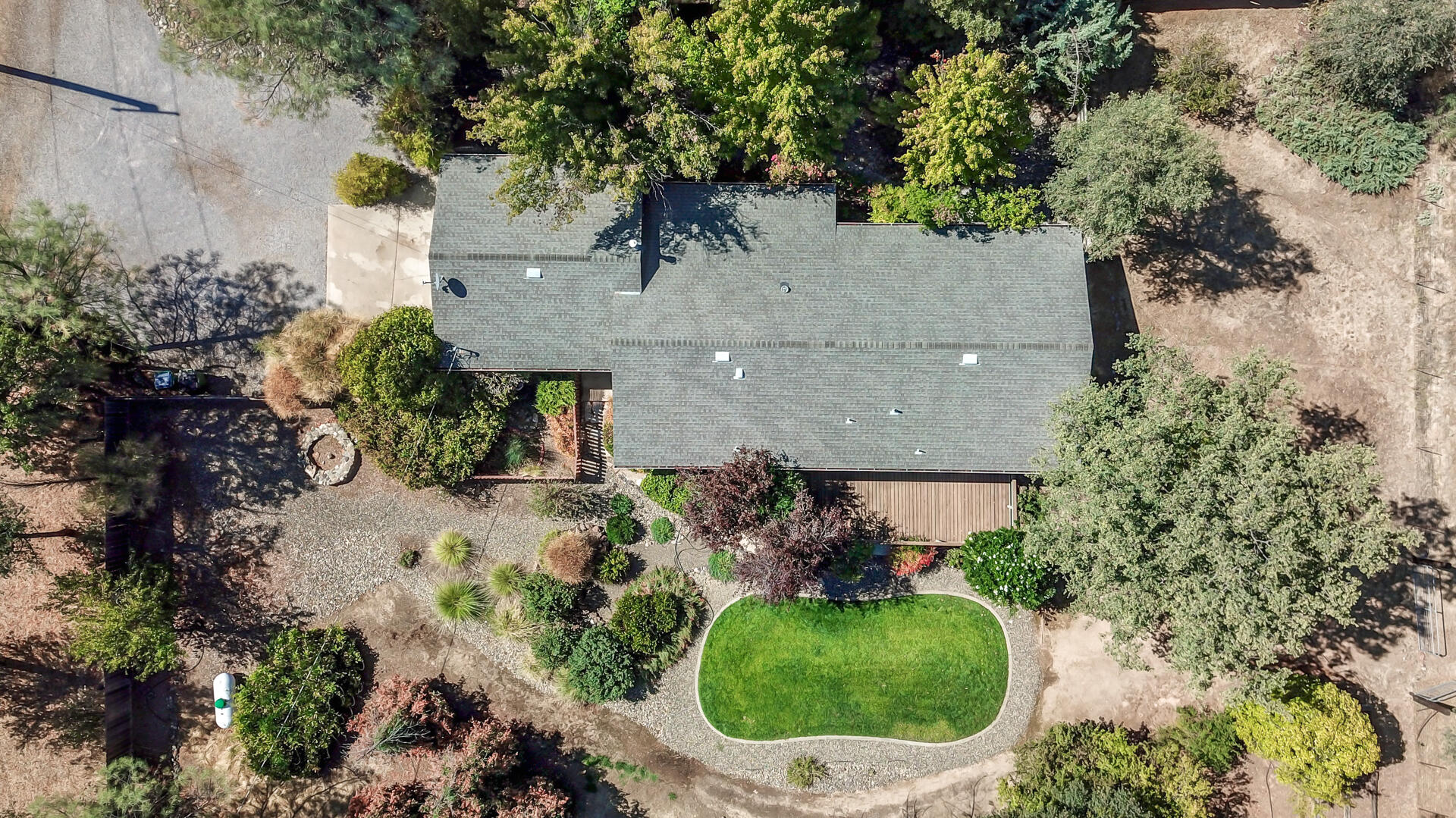 an aerial view of a house with outdoor space