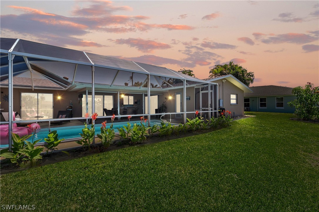 a view of a house with garden and yard