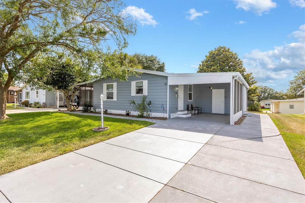 Manicured Curb Appeal with Expanded Driveway