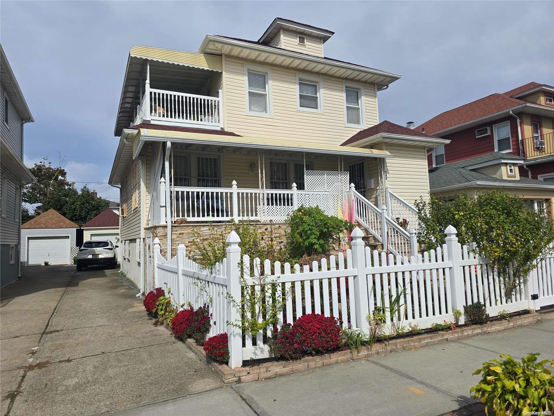 a front view of a house with a porch