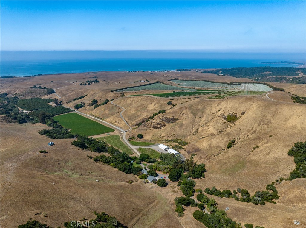 an aerial view of beach and ocean