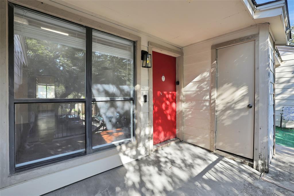 a view of a glass door with a living room