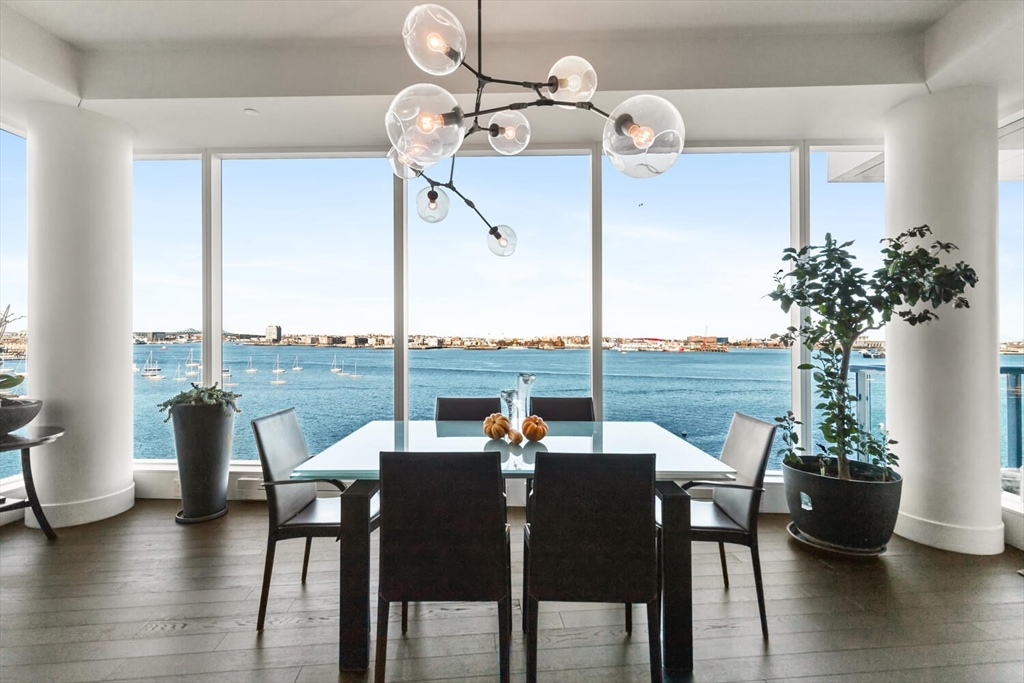 a view of a dining room with furniture window and wooden floor