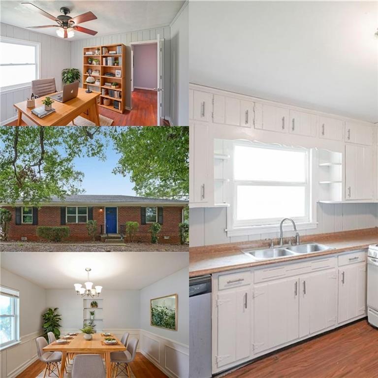 a kitchen with stainless steel appliances kitchen island granite countertop a sink and a white cabinets