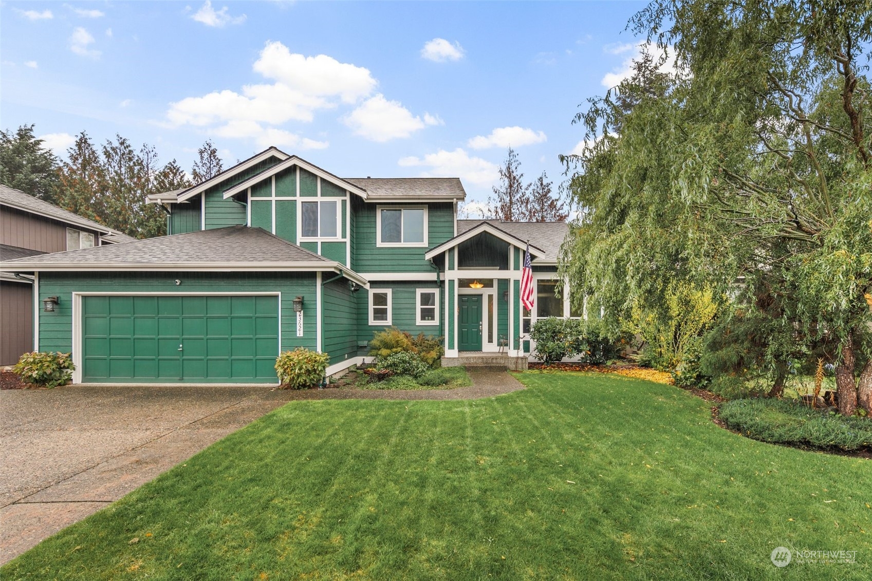 a front view of a house with garden