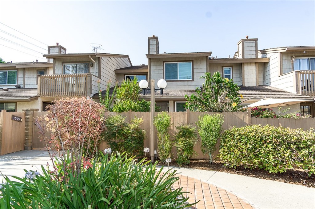 a view of a house with a yard and plants