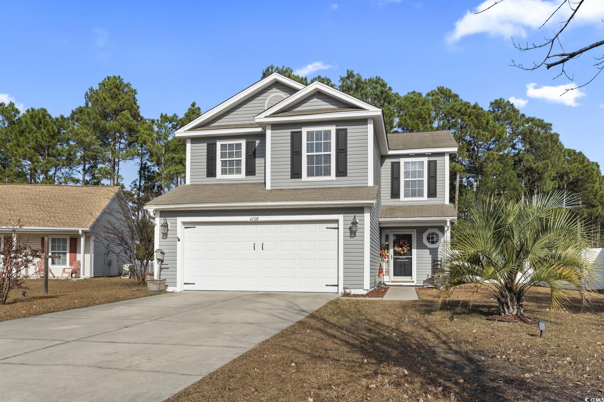 View of front of property with a garage