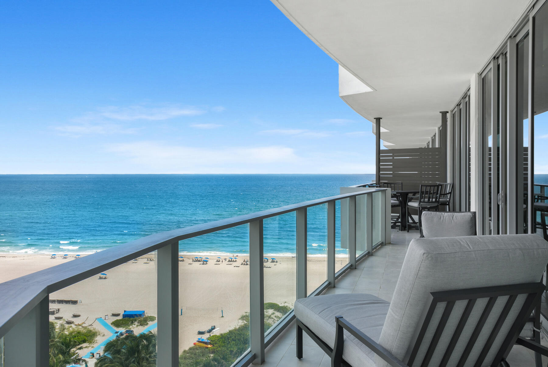 a view of a balcony with ocean view