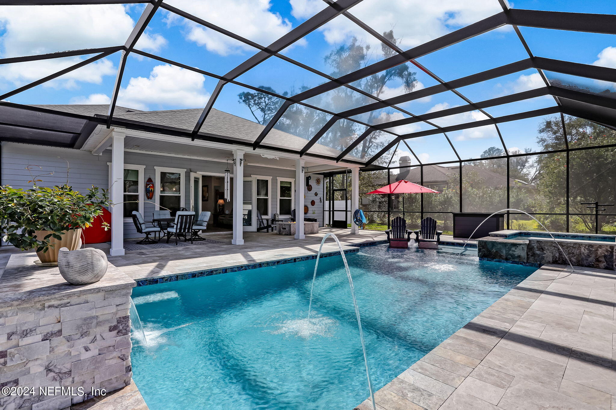 a view of a backyard with sitting area