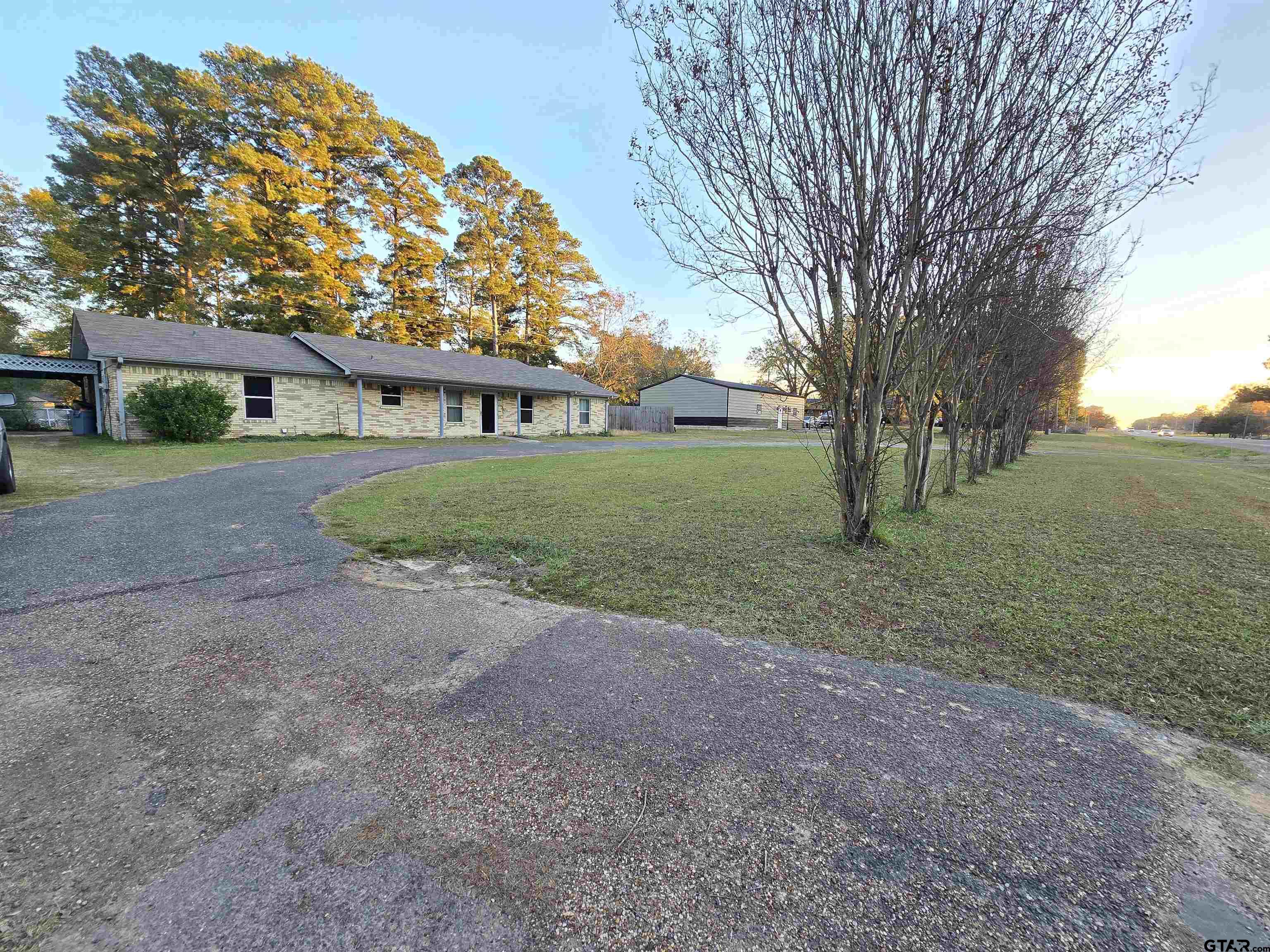 a view of a house with a yard