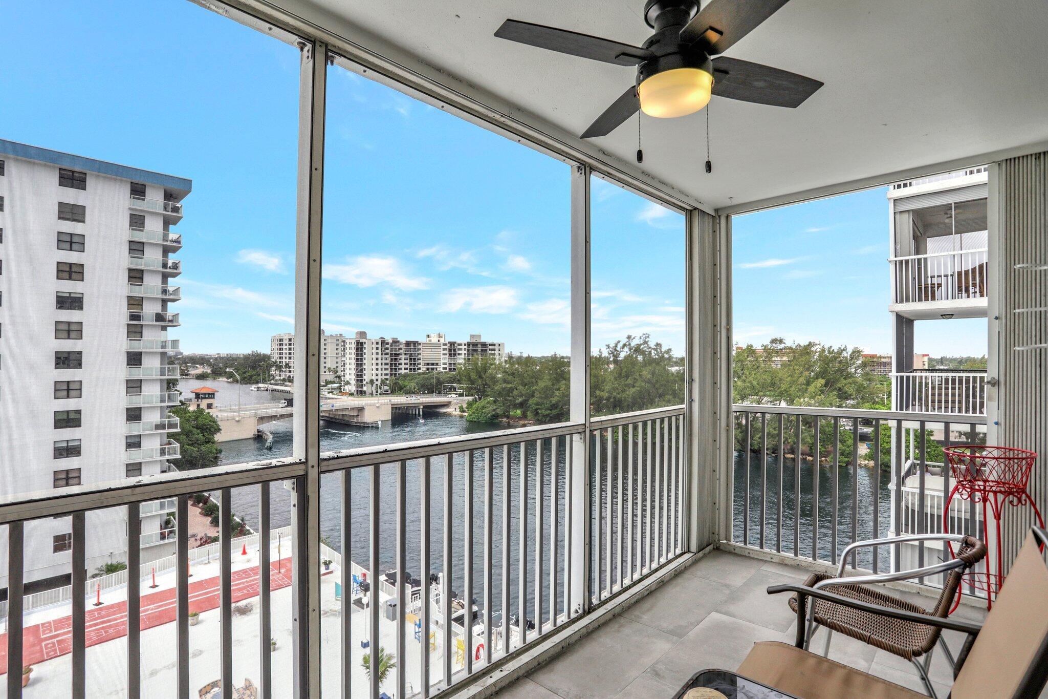 a view of a balcony with furniture