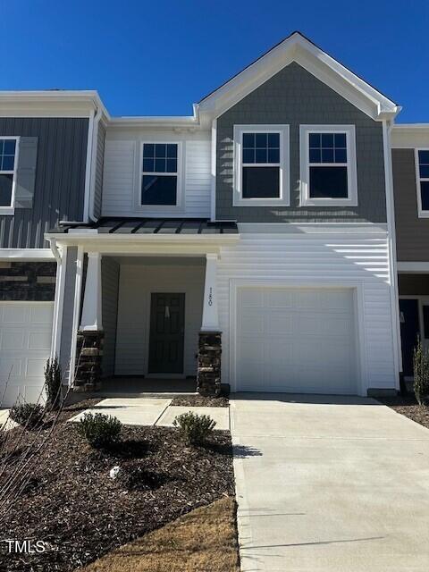 a front view of a house with a garage