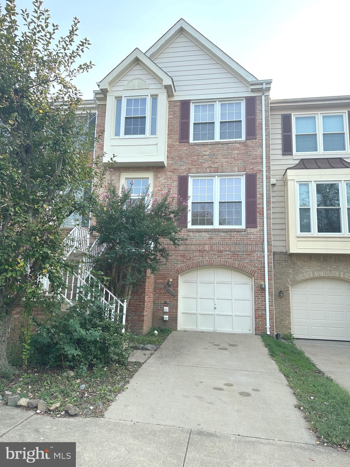 a front view of a house with a garage