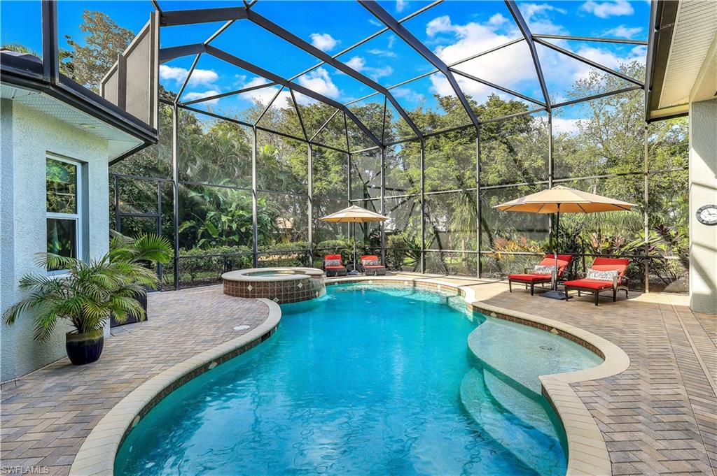 a view of swimming pool with a patio