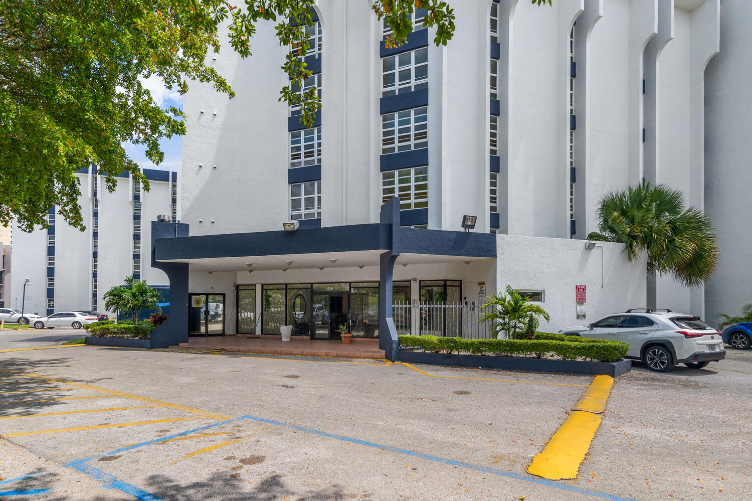 front view of a building with potted plants