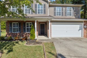 front view of a house with a yard