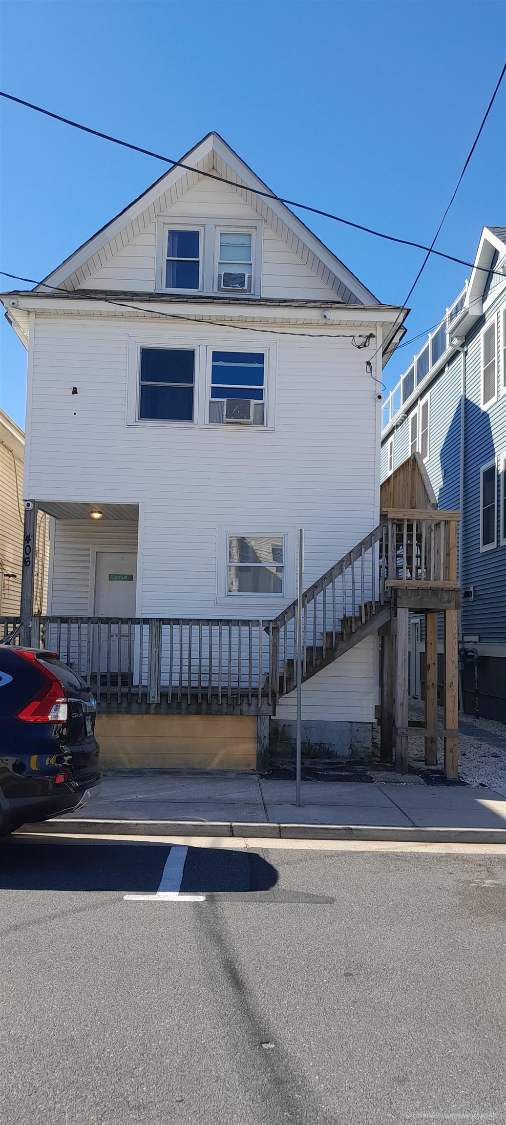 a view of a car park in front of a house