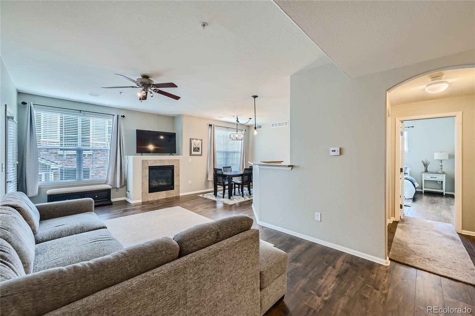 a living room with furniture and a fireplace