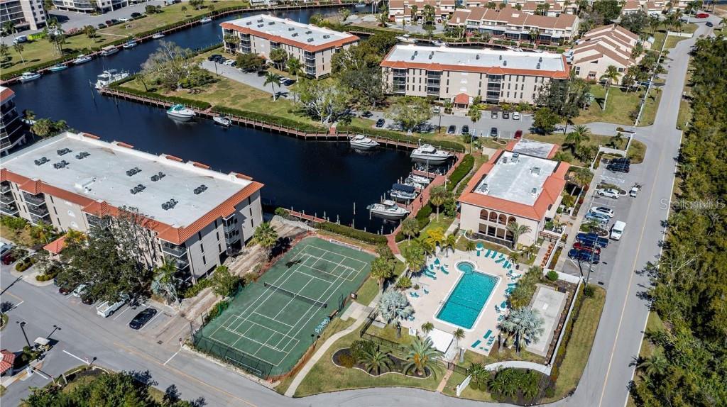 an aerial view of a residential building with an outdoor space