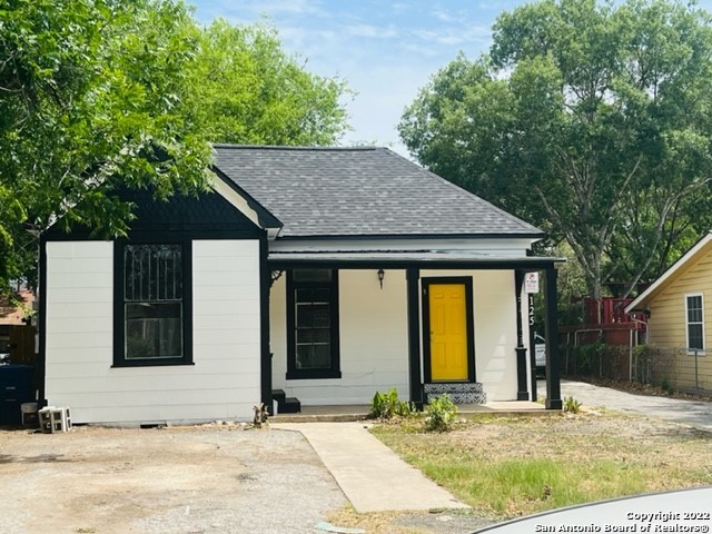 a house with trees in the background