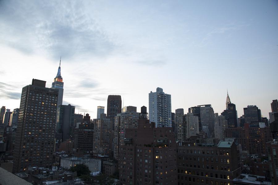 a view of a city with tall buildings