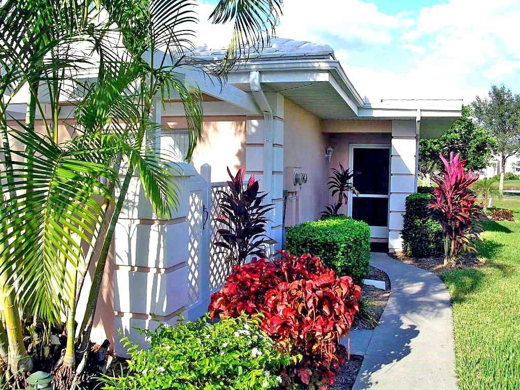 a front view of house with small garden