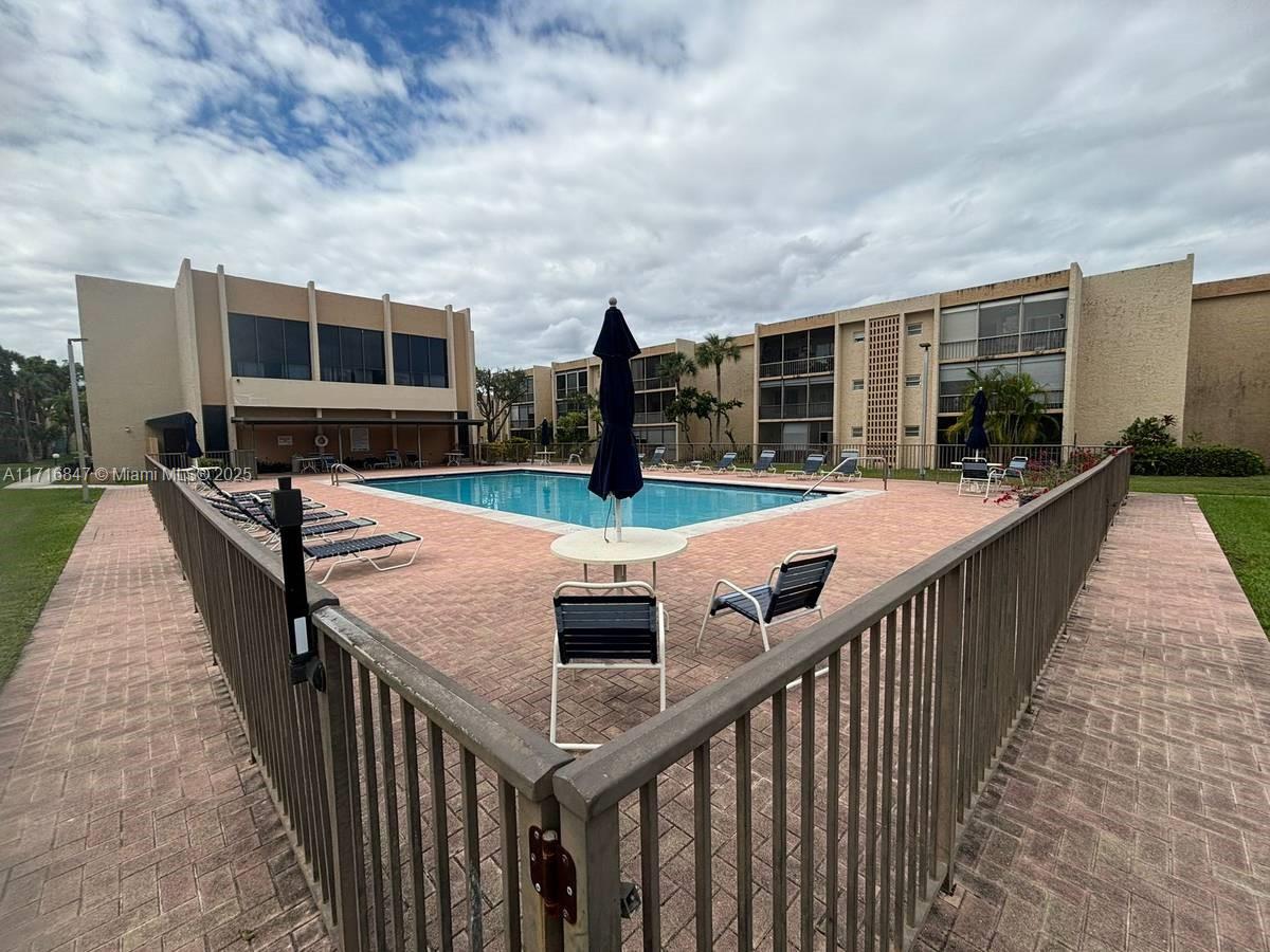 a view of a patio with swimming pool