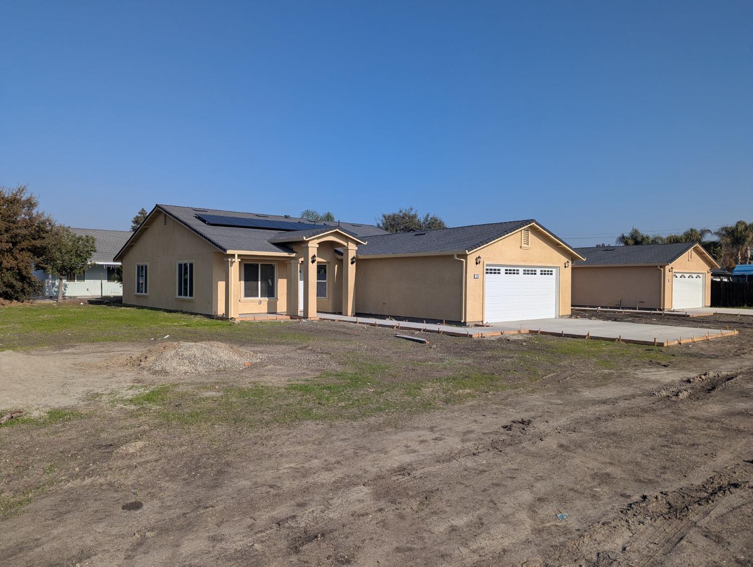 a view of house with backyard and space