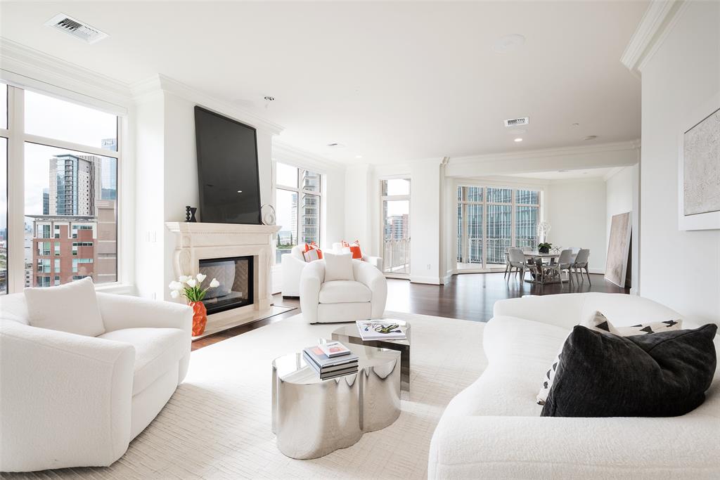 a living room with furniture fireplace and a flat screen tv