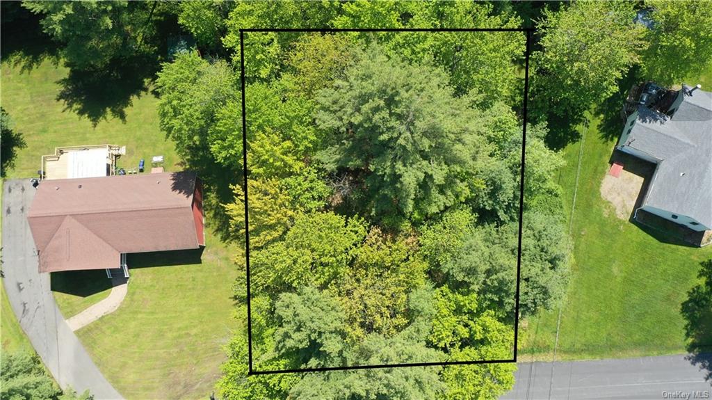 an aerial view of residential house with an outdoor space